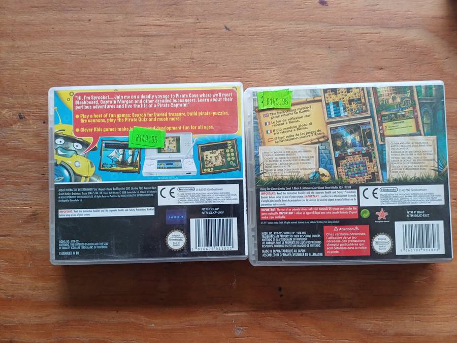 Nintendo DS Bundle (Console Charger and 2 games)