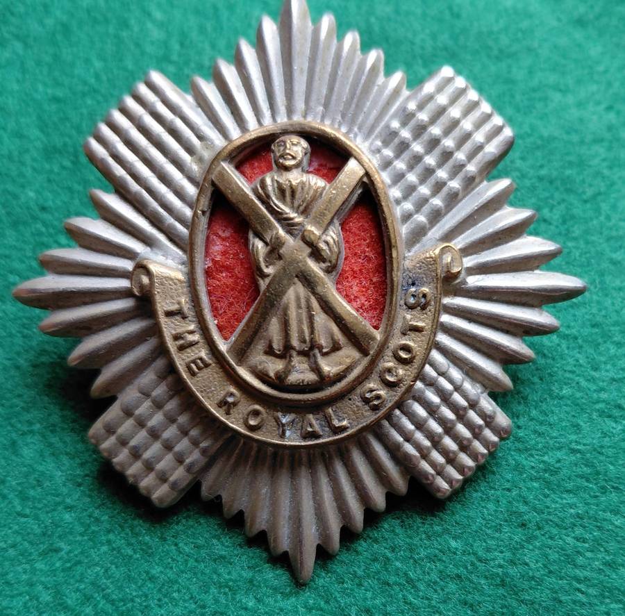 British Army, Royal Scots BiM cap badge with red backing for 1st Battalion