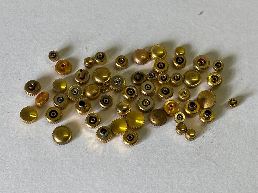 Assorted gold watch crowns - 50+ pieces