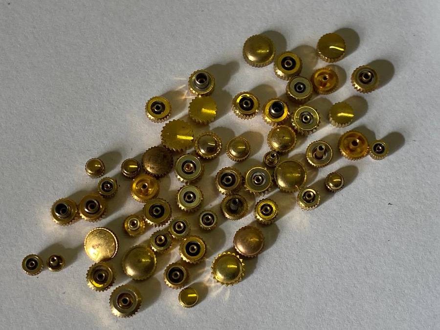 Assorted gold watch crowns - 50+ pieces