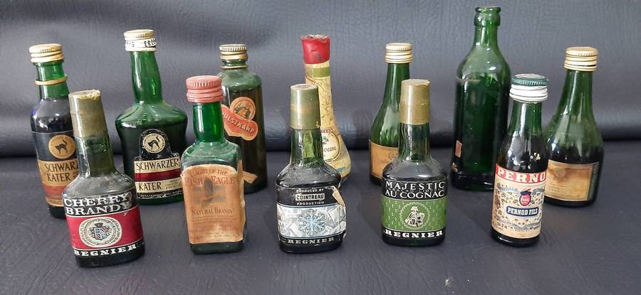 GREEN GLASS MINIATURE LIQUOR BOTTLES  VINTAGE BAR DISPLAY LOT OF 12