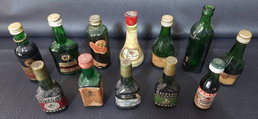 GREEN GLASS MINIATURE LIQUOR BOTTLES  VINTAGE BAR DISPLAY LOT OF 12