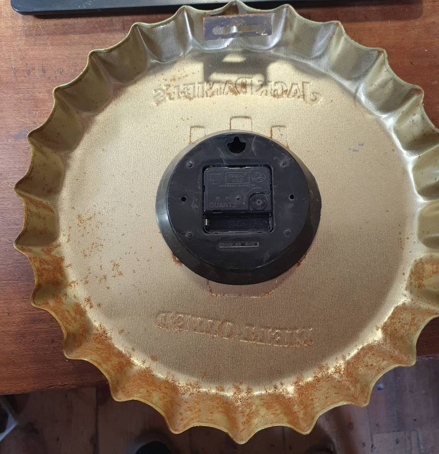 VINTAGEJACK DANIELS   HUGE EMBOSSED METAL BOTTLE LID SHAPE WATCH. 360mm DIA.