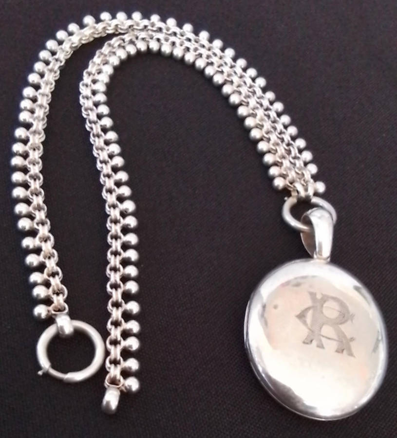 Silver Oval Pendant on Decorative Chain