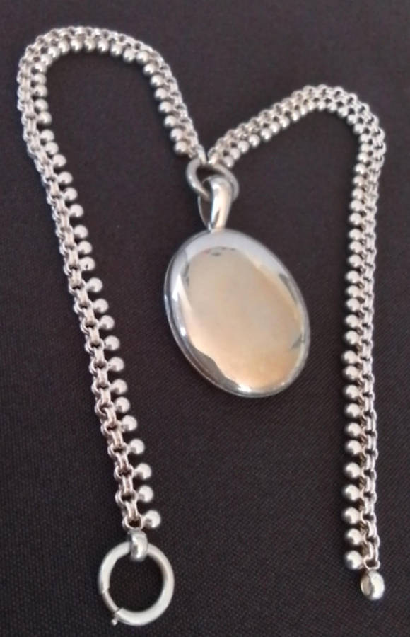 Silver Oval Pendant on Decorative Chain