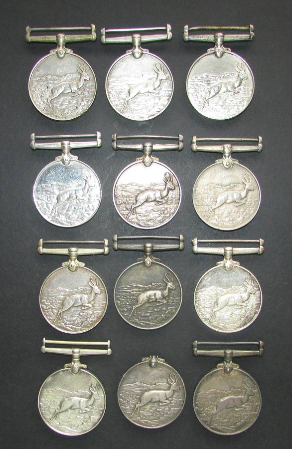 12 Full Size ( Silver ) Africa Service Medals issued to various Recipients ( Under Silver Value )