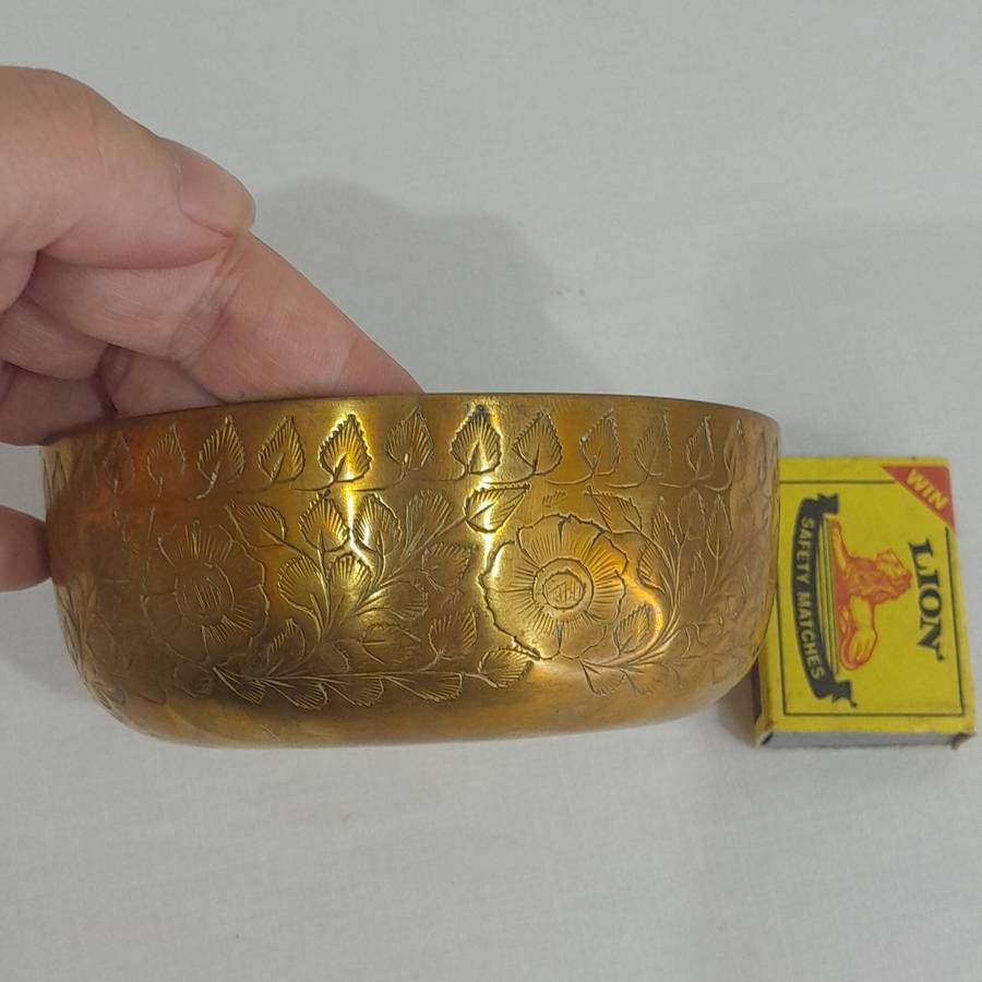 Beautiful and polished brass bowl with leaf and flower engraving