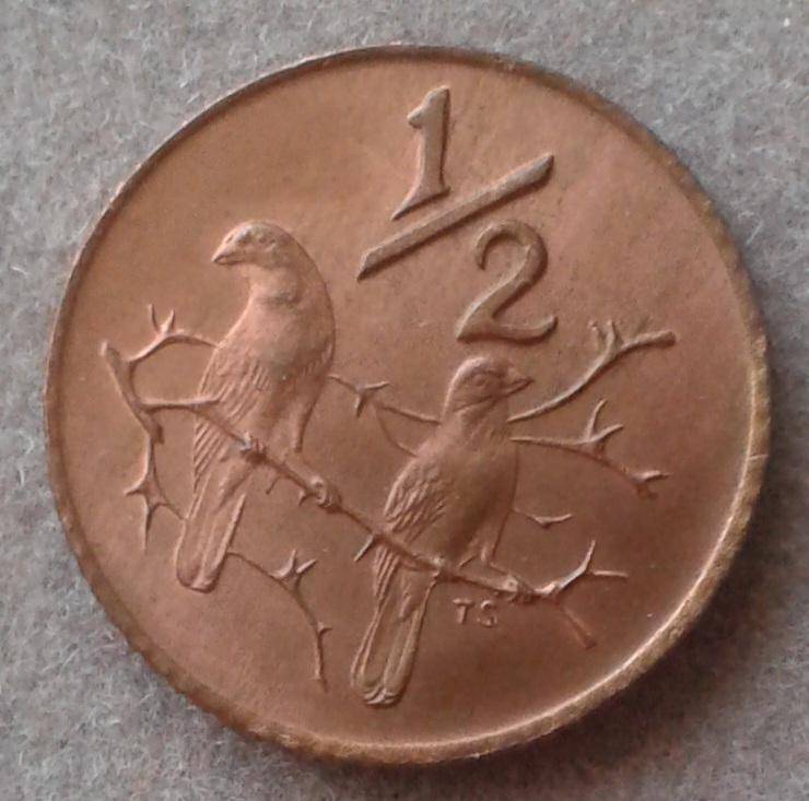 Scarcer 1975 uncirculated 1/2c (mintage: 20000).