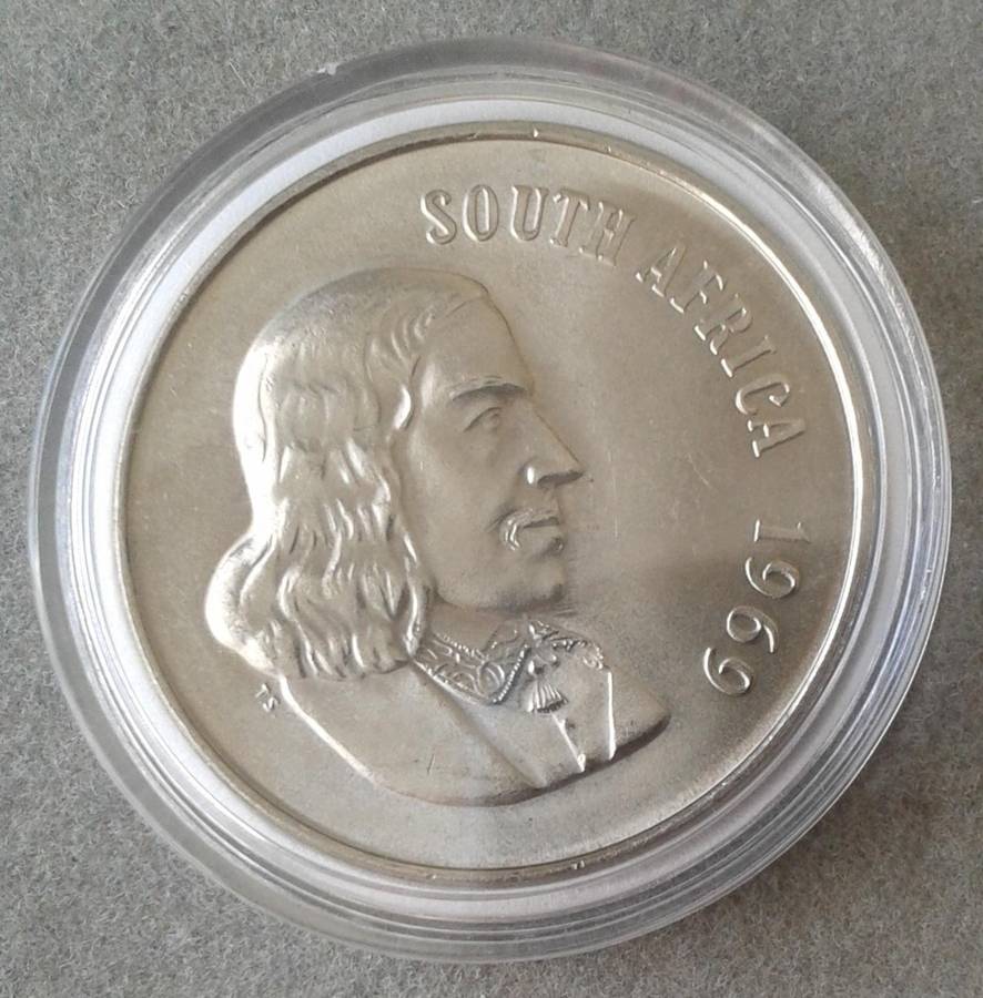 Encapsulated  1969 English uncirculated nickel 50c (mintage: 7968)