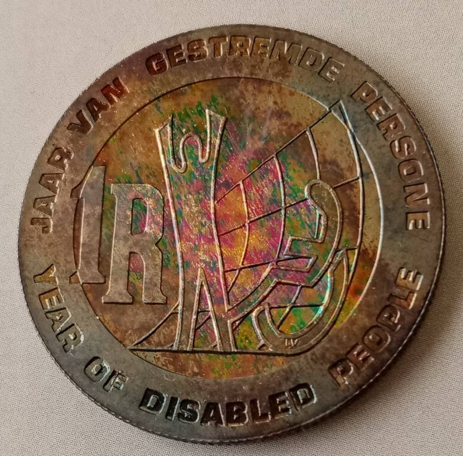 Nice 1986 YOD proof silver R1 with rainbow toned reverse