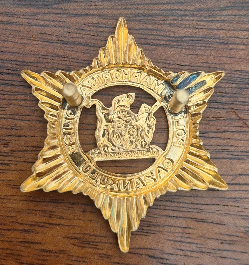EX HOMELAND - GAZANKULU POLICE CAP BADGE - SCREWS INTACT