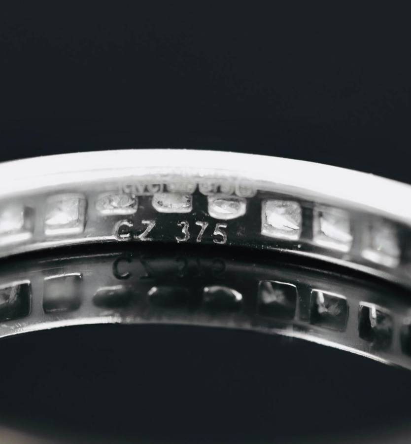 9ct  WHITE GOLD CHANNEL SET CUBIC ZIRCONIA ETERNITY RING. LONDON, ENGLAND HALLMARKED