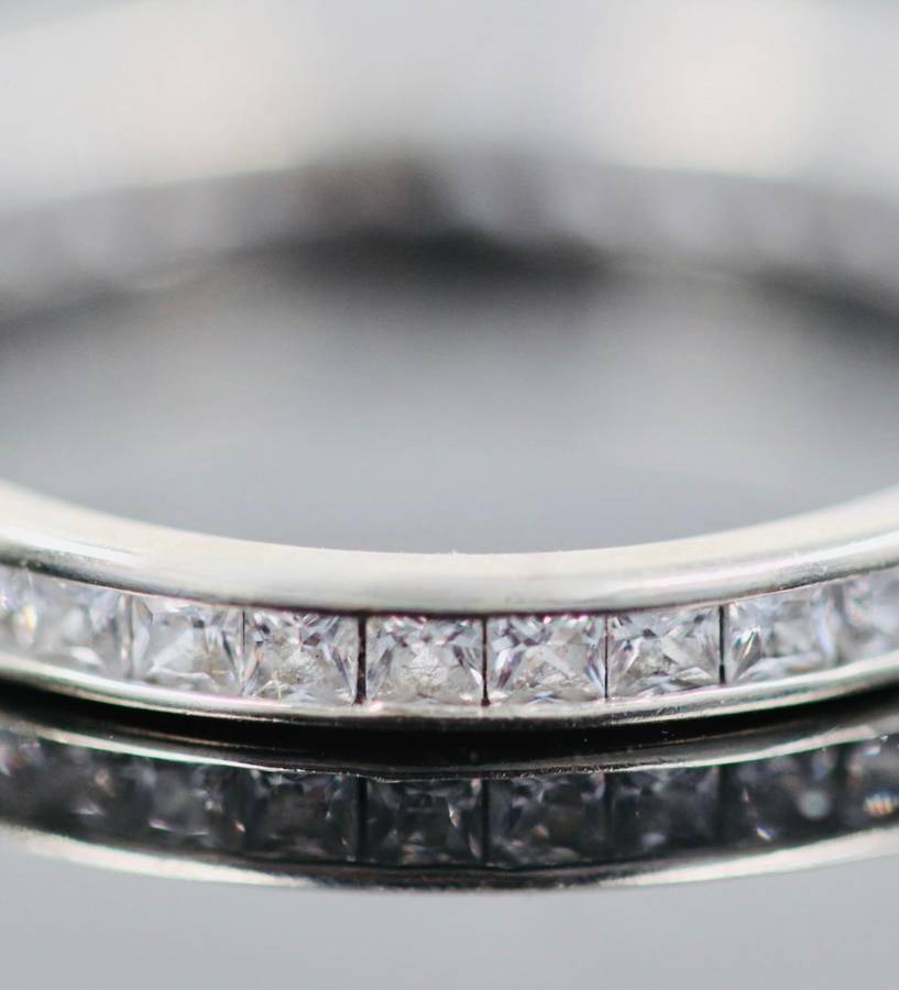 9ct  WHITE GOLD CHANNEL SET CUBIC ZIRCONIA ETERNITY RING. LONDON, ENGLAND HALLMARKED