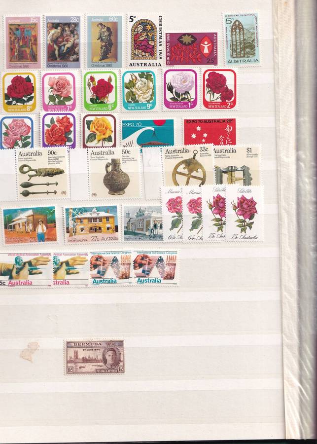 Green 15 page stamp album with some stamps, good used condition