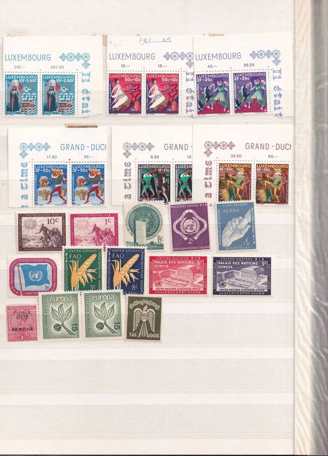 Green 15 page stamp album with some stamps, good used condition