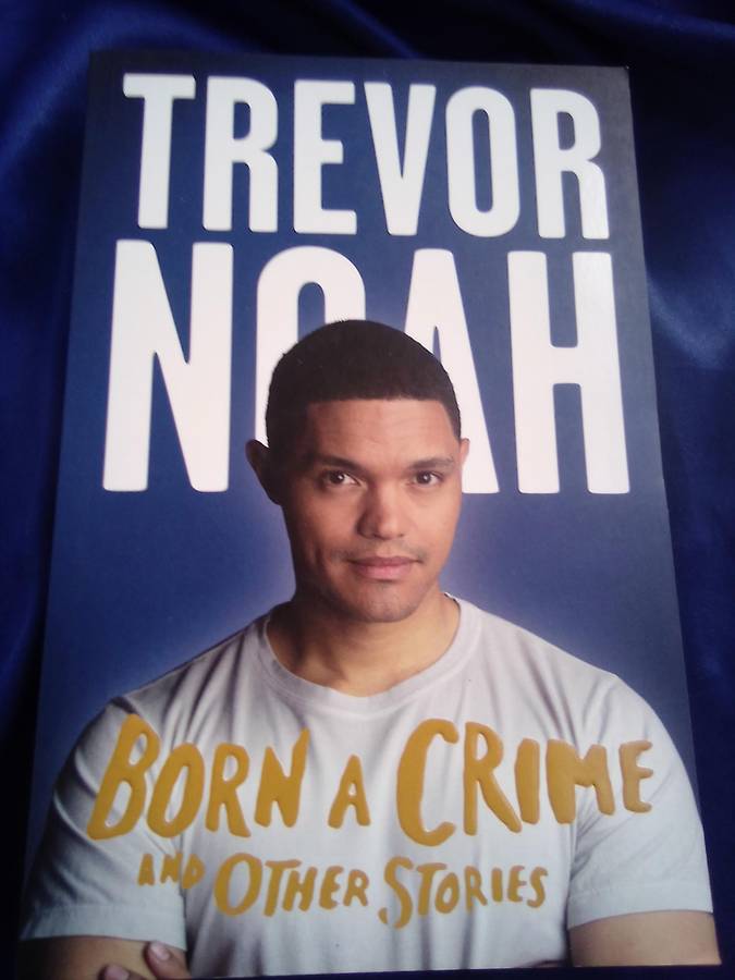 "Born a Crime`  Trevor Noah.  Soft cover.