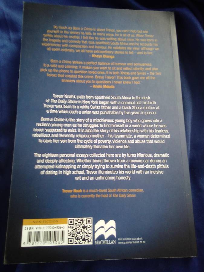 "Born a Crime`  Trevor Noah.  Soft cover.