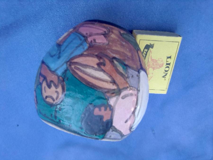 Small, painted and signed pot.