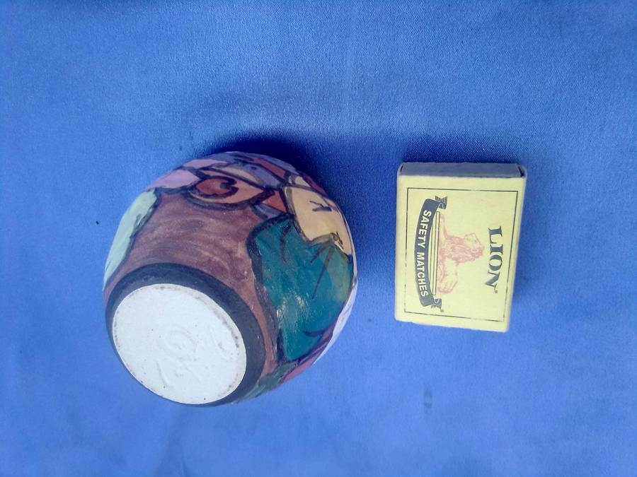 Small, painted and signed pot.