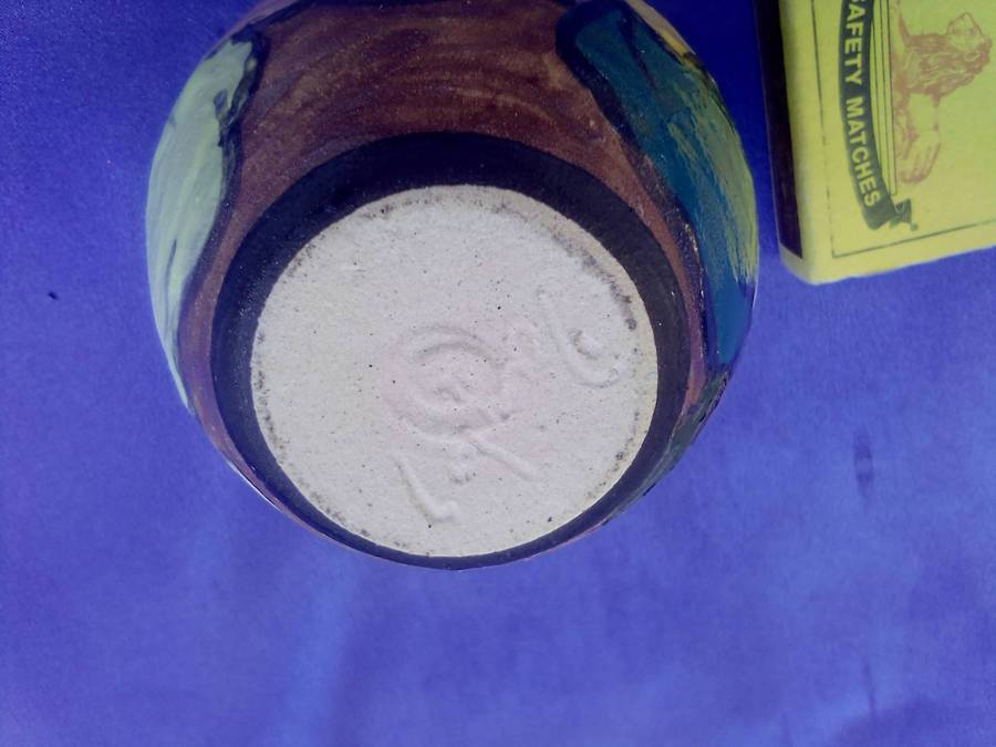 Small, painted and signed pot.