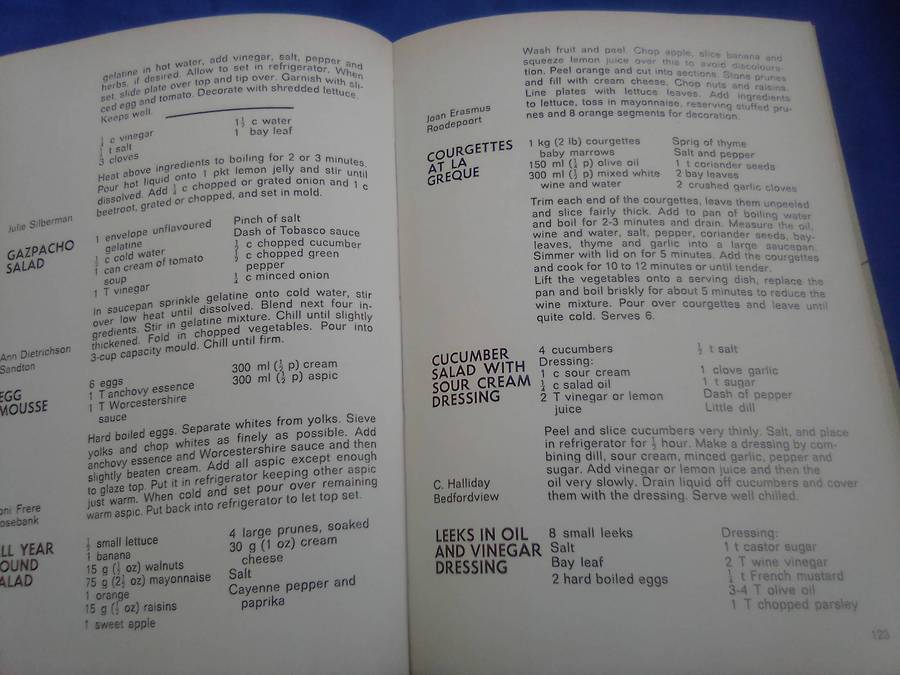 `"Die Huisvroue Liga / The Housewives League Cookery Book" Hard cover.