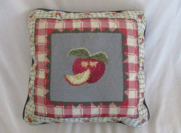 A cute Rug Barn "Needlepoint by hand" tapestry cushion