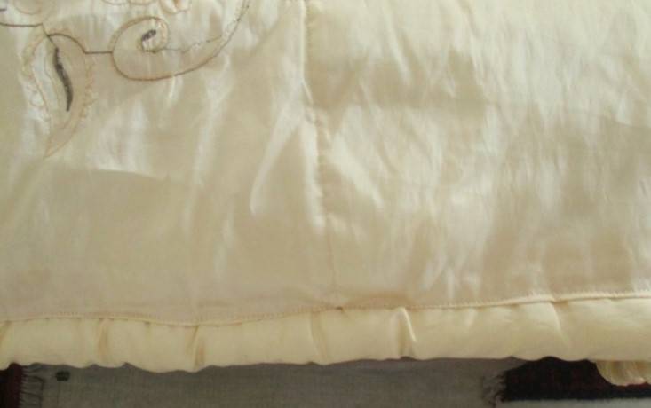 An enormous embroidered light gold comforter to fit king & queen size bed - 269cm x 262cm