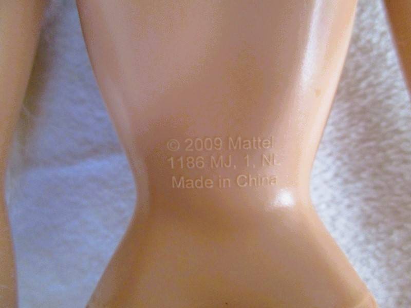 Relisted - An articulated Mattel Barbie doll with very long hair in cute Barbie? tracksuit