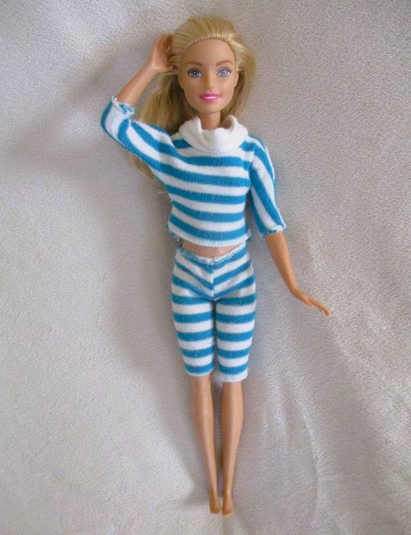 A pretty Mattel Barbie doll  in cute striped tracksuit