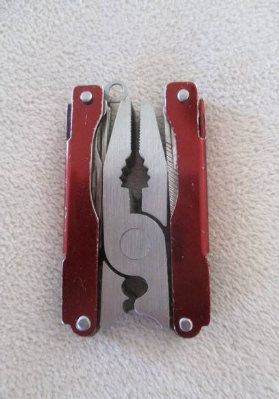 Small vintage Victorinox Swiss Army Knife plus other small fold-up tool gadget