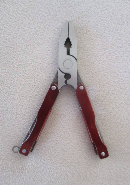 Small vintage Victorinox Swiss Army Knife plus other small fold-up tool gadget