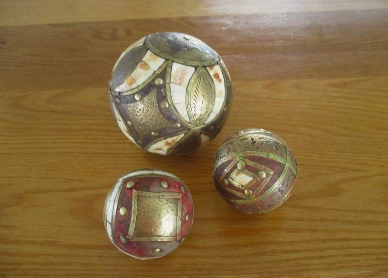 Three heavy vintage Middle Eastern bone and brass inlaid balls - very decorative