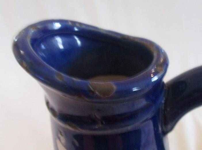 Large, unique purposefully antique-looking ceramic jug vase made to resemble aged enamel