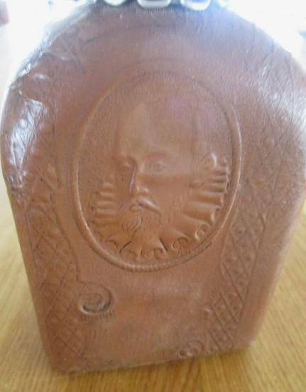 Two beautifully decorative Spanish hand made leather embossed decanters