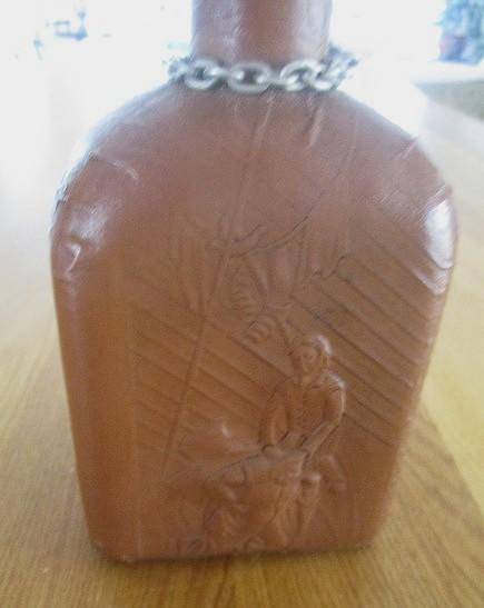 Two beautifully decorative Spanish hand made leather embossed decanters