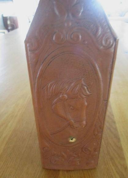 Two beautifully decorative Spanish hand made leather embossed decanters