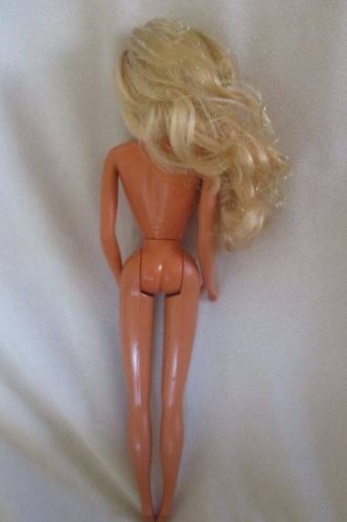 A Mattel Barbie doll with tinsel in her hair - 1991 Sun Sensation Barbie? -  Knees bend