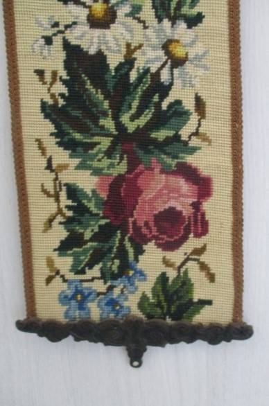 Well made vintage tapestry wall hanging with roses and flowers and ornate metal top and bottom frame