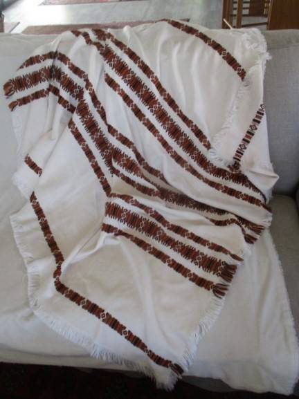 A large, quality throw with embroidered geometric design - in great condition