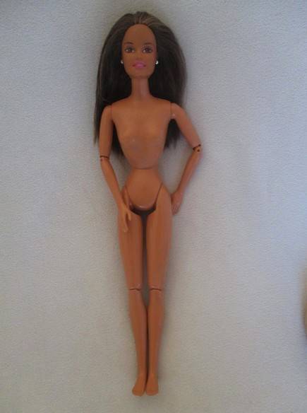 Pretty articulated Mattel Barbie with original top and earrings - Operations Safari Barbie?