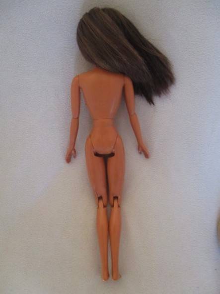 Pretty articulated Mattel Barbie with original top and earrings - Operations Safari Barbie?