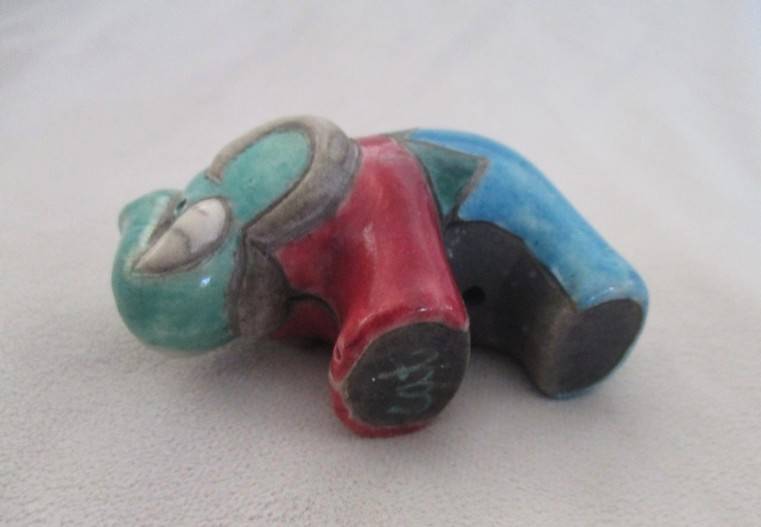 A small Raku elephant -signed by artist - great condition