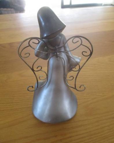 A silver tone metal angel