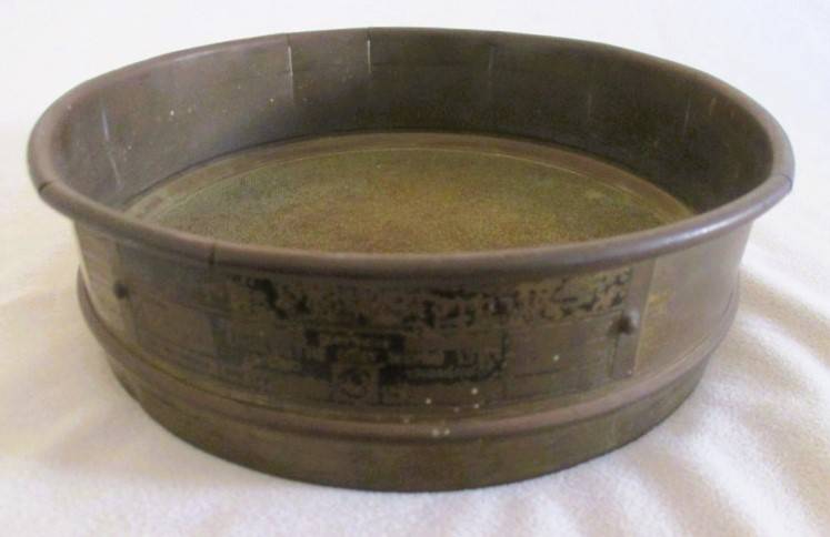 A very old antique gold panning sieve made in England