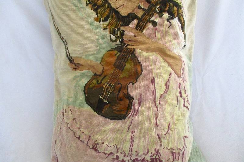 A large hand made cushion combining Petit Point and ordinary tapestry - girl playing violin