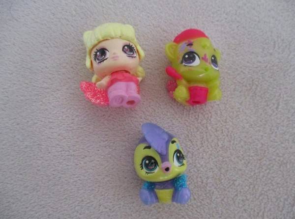 A plastic egg carton containing twelve Hatchimals CollEGGtibles