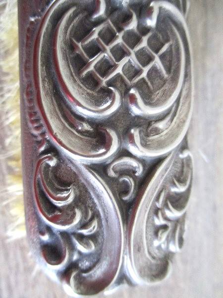 Two antique Victorian Art Nouveau repousse silver plated clothes brushes