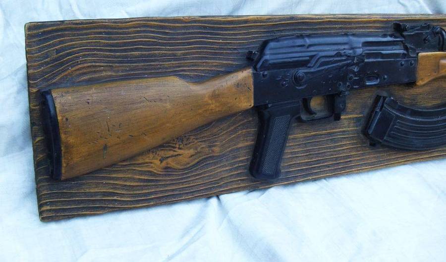 A rare vintage late 1980`s hard foam wall mount demonstrational mold of an AK47 assault rifle