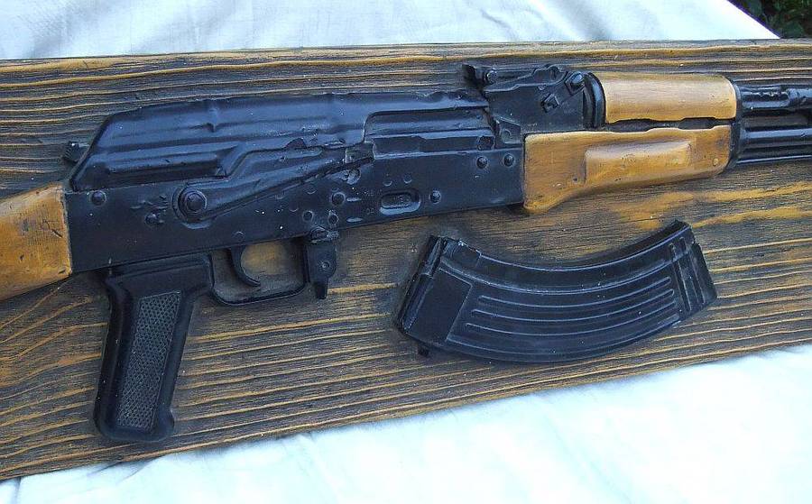 A rare vintage late 1980`s hard foam wall mount demonstrational mold of an AK47 assault rifle