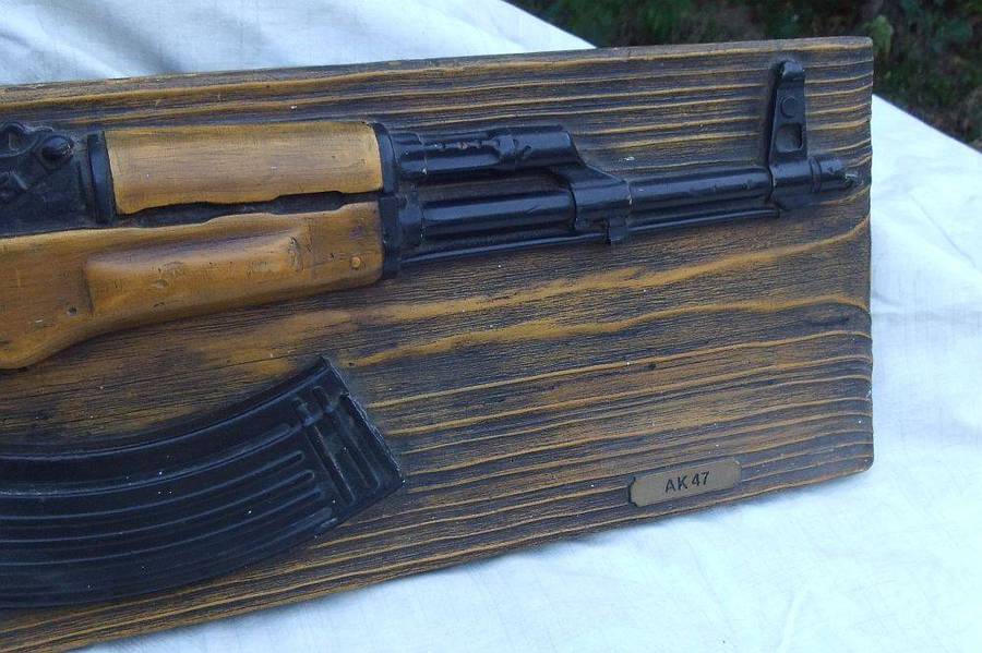 A rare vintage late 1980`s hard foam wall mount demonstrational mold of an AK47 assault rifle